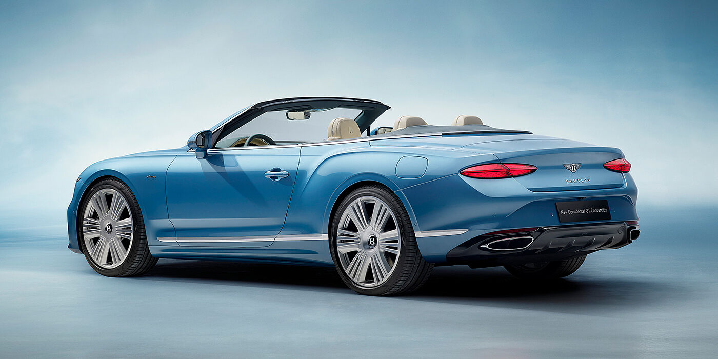Bentley St Peter New Bentley Continental GTC Azure convertible rear view in Light Windsor blue paint with 22 inch ten spoke wheels and chrome exterior details