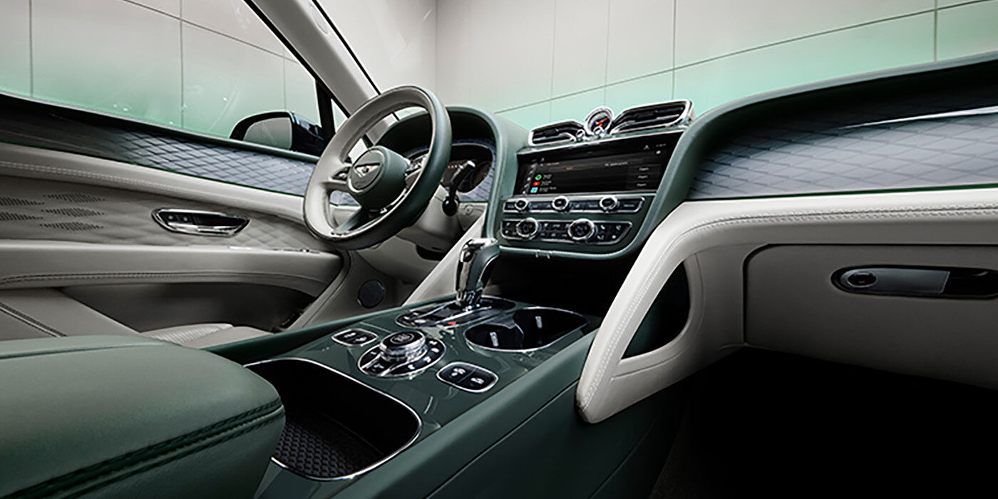Bentley St Peter Bentley Bentayga Atelier Edition SUV front interior in Portland and Cumbrian Green hides with Dark Tint Diamond Brushed Aluminium veneer