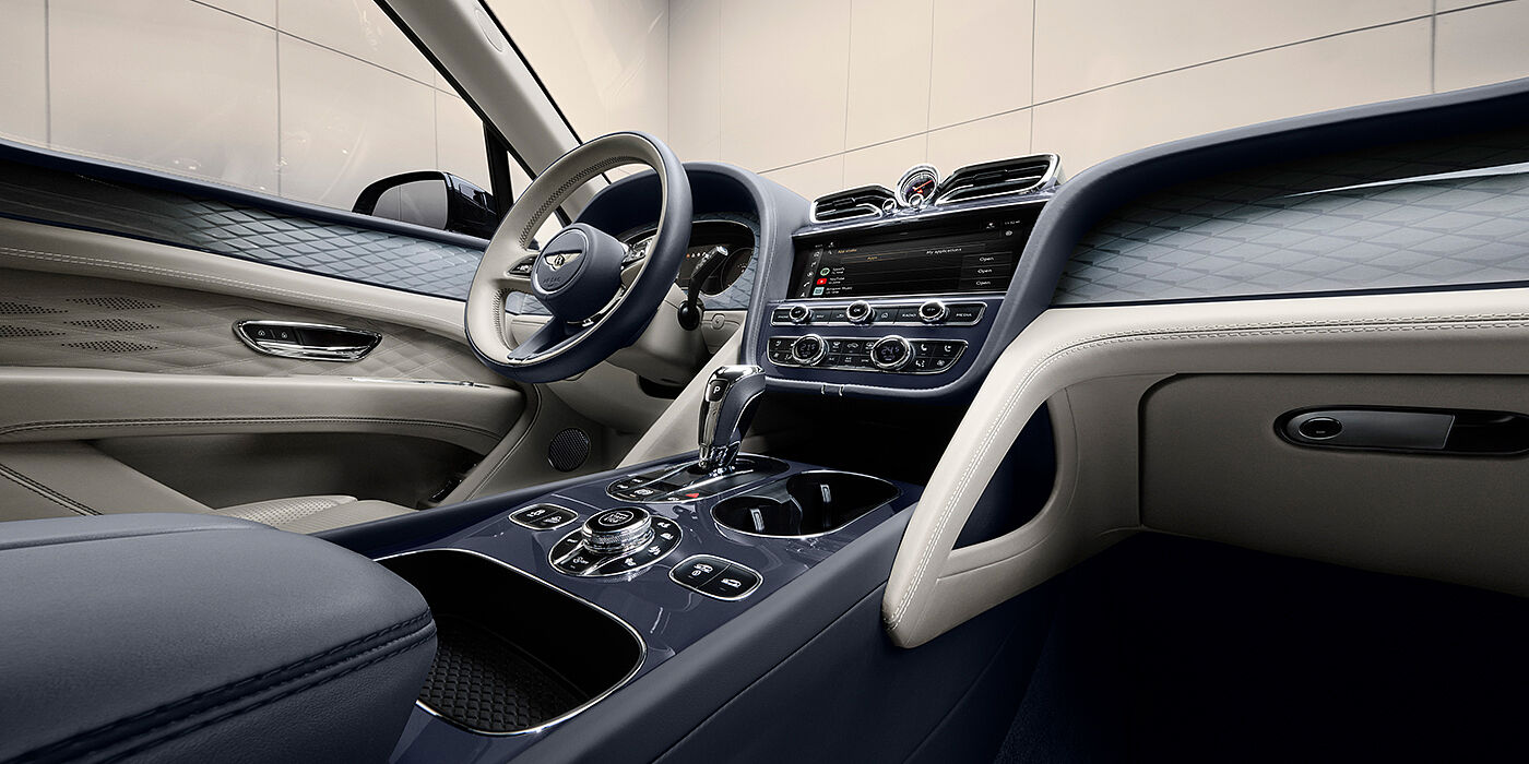 Bentley St Peter Bentley Bentayga Atelier Edition SUV front interior in Linen and Imperial Blue hides with Dark Tint Diamond Brushed Aluminium veneer