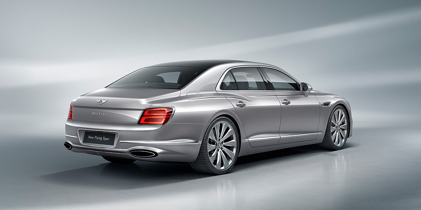 Bentley St Peter New Bentley Flying Spur sedan rear view in Silverlake paint with ten spoke wheels and chrome matrix grille
