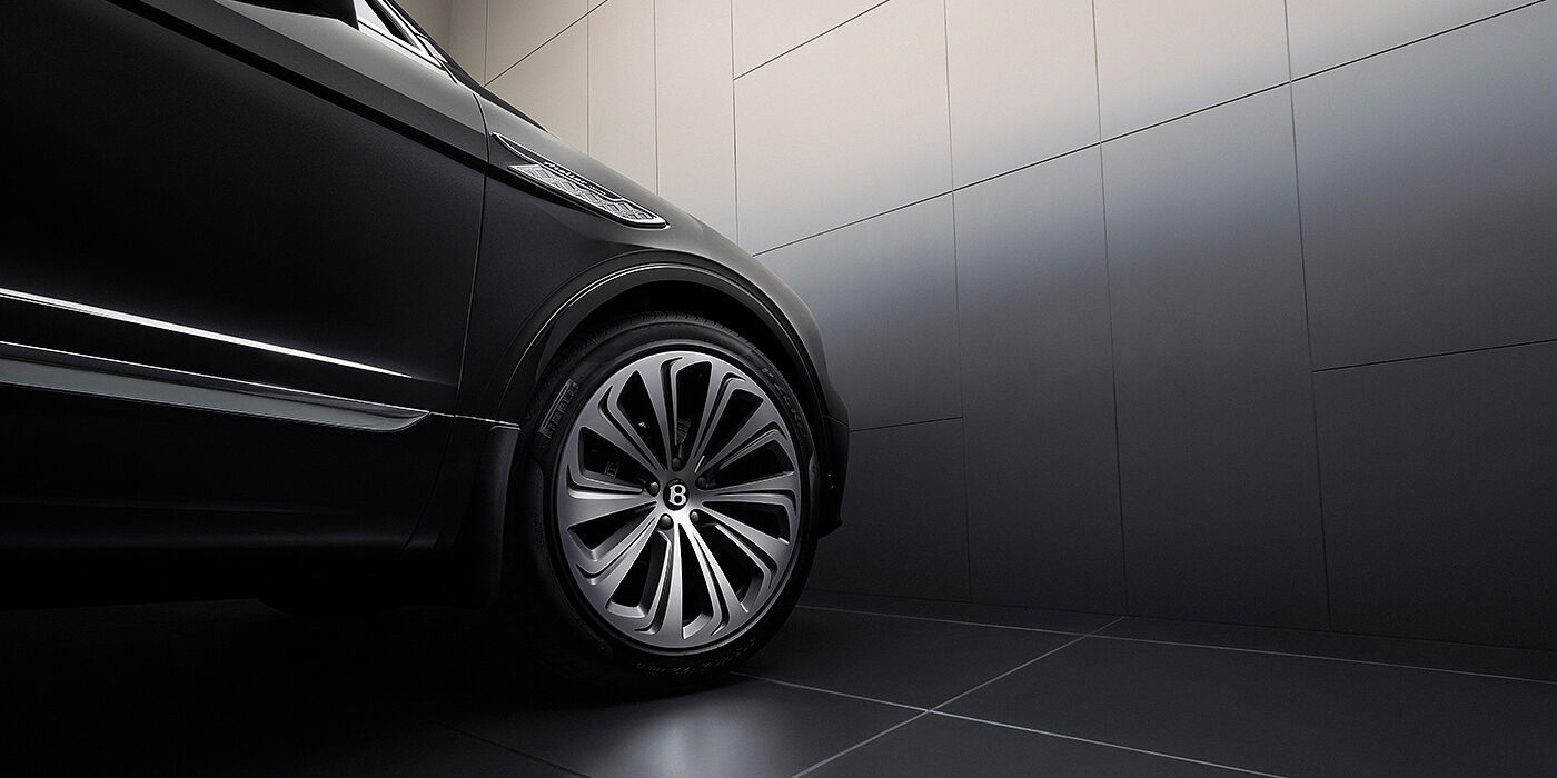 Bentley St Peter Bentley Bentayga Atelier Edition SUV in Onyx black paint front side detail with 22 inch 10 spoke wheel