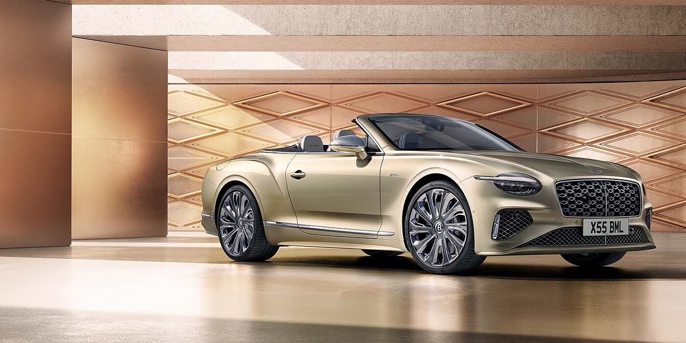 Bentley St Peter Bentley New Continental GTC Mulliner V8 hybrid front three quarters in Patina paint