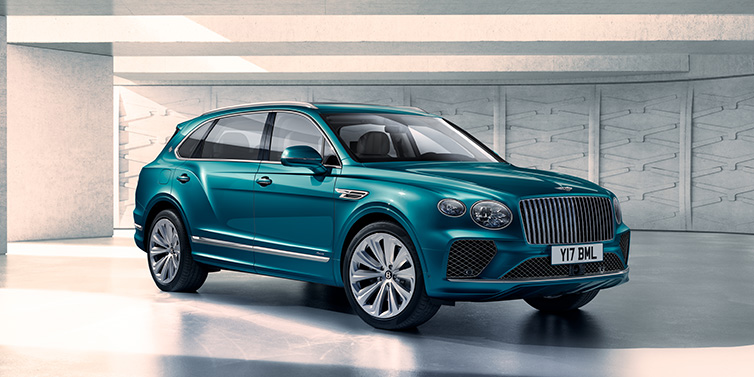 Bentley St Peter Bentley Bentayga Extended Wheelbase Azure SUV front three quarter in Topaz blue paint colour with a grey background