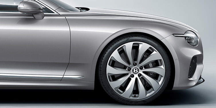 Bentley St Peter New Bentley Continental GT coupe side view featuring bonnet in Silverlake paint and 22 inch ten spoke silver painted and bright machined wheel